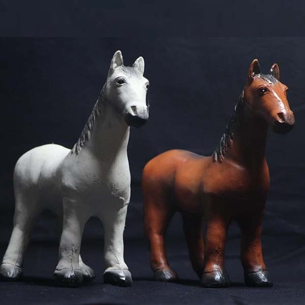 A stylized 4K image showing a variety of colorful, custom-designed rubber toys arranged on a clean white background. The toys should be the focus, showcasing their unique shapes, colors, and designs. The image should be brightly lit and have a clean, modern aesthetic. The style should resemble high-quality product photography often used for e-commerce websites.